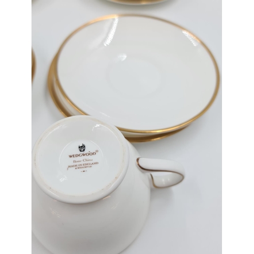 475 - Six Wedgwood gold and white patterned bone china trios