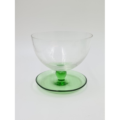 489 - A collection of vintage green glassware to include seven piece uranium glass drinking set comprising... 