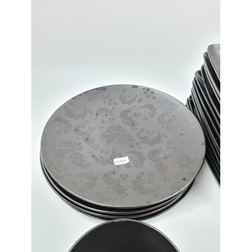 493 - A collection of black dinnerware to include five Next Diffusion plates (four dinner and one side), f... 