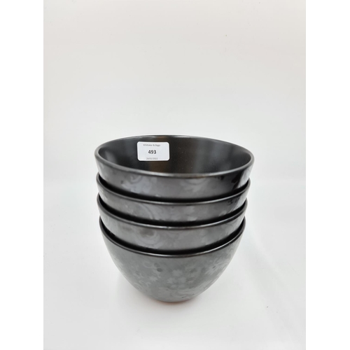 493 - A collection of black dinnerware to include five Next Diffusion plates (four dinner and one side), f... 