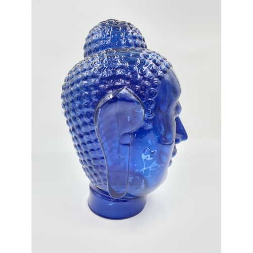 495 - A large blue glass Thai buddha head - approx. 41cm high