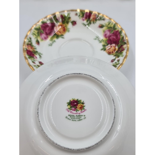 498 - Fourteen pieces of Royal Albert Old Country Roses bone china to include two tea cups, egg shaped tri... 