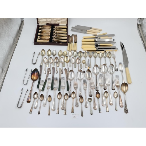 505 - A large collection of assorted vintage cutlery to include hallmarked Sheffield sterling silver tea s... 