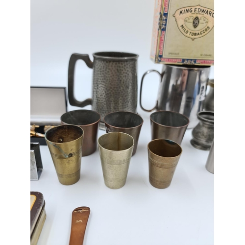 508 - A collection of assorted items to include coins, pewter tankards, vintage smoking pipes, badges, Cai... 