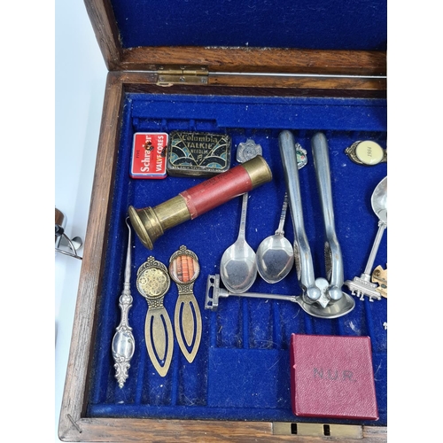 509 - An early 20th century oak cutlery box containing assorted items to include Victorian white metal but... 