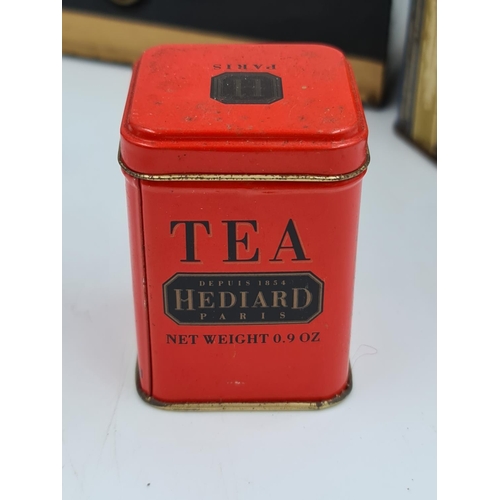 517 - A collection of assorted items to include vintage novelty tins, early 20th century postal scale etc.