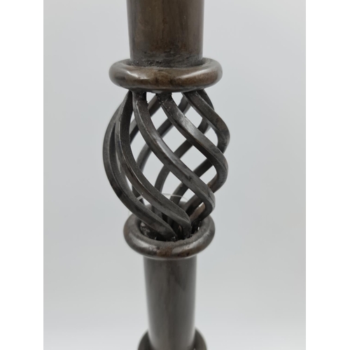 526 - A 19th century style metal tri footed candle holder - approx. 73cm high