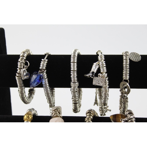 223 - Twenty contemporary fashion charm link bracelets