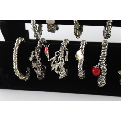 223 - Twenty contemporary fashion charm link bracelets