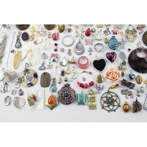 227 - Approximately 1kg of vintage and retro pendants