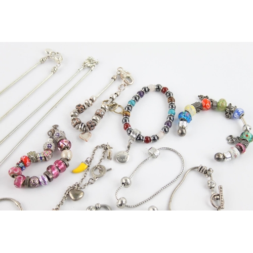 232 - Twenty contemporary fashion charm bracelets