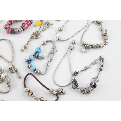 232 - Twenty contemporary fashion charm bracelets