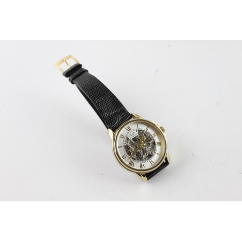 262 - A boxed gents Rotary quality gold tone automatic wristwatch with skeletonised movement and black liz... 