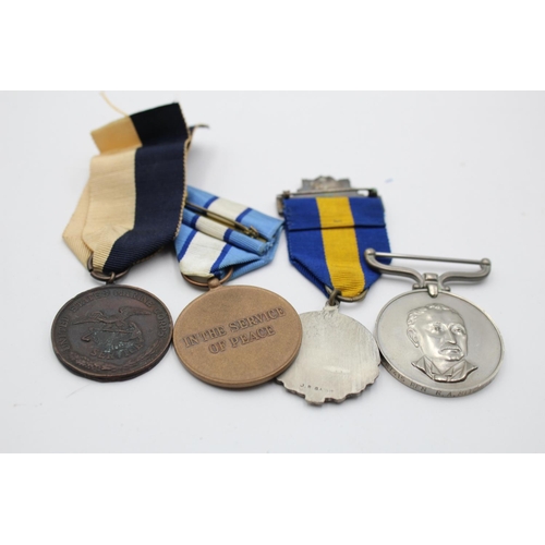 270 - Five assorted medals, one boxed Civil Defence, one Rhodesian medal presented  to PR7415 RFN. R.A. Mi... 