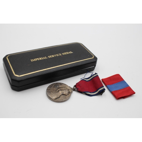 271 - Two vintage boxed medals, one Elizabeth II Imperial Service medal presented to William Gilbey M.B.E ... 