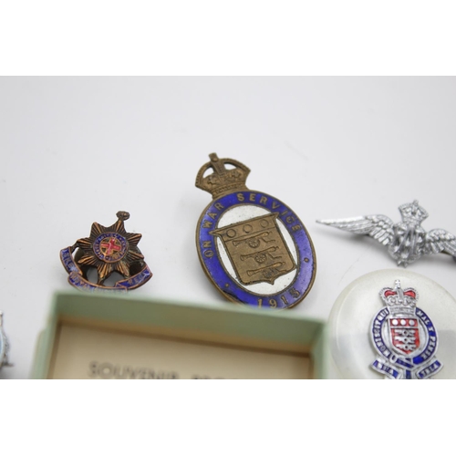 280 - Fifteen assorted vintage military lapel and sweetheart badges to include Royal Navy, RAF etc.