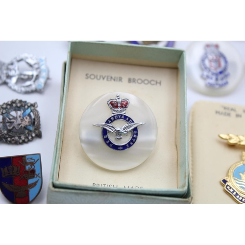 280 - Fifteen assorted vintage military lapel and sweetheart badges to include Royal Navy, RAF etc.