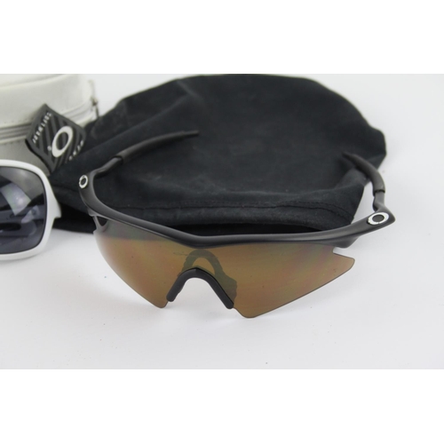 309 - Four pairs of Oakley sunglasses