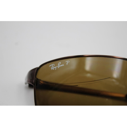 310 - A pair of Ray-Ban brown framed rectangular sunglasses with polarized lenses and case