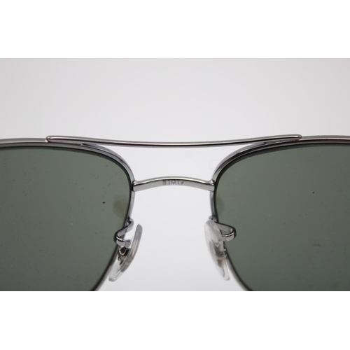 312 - A pair of Ray-Ban thick chrome metal framed sunglasses with polarized lenses and case