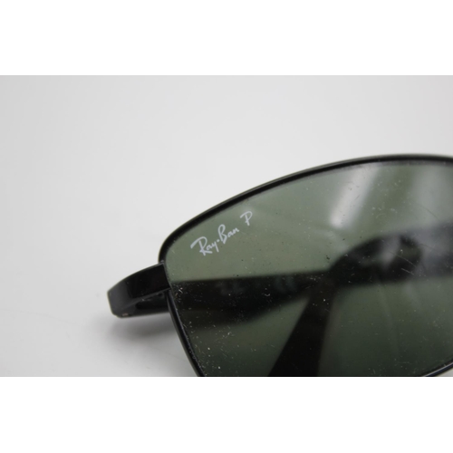 315 - A pair of Ray-Ban black framed rectangular sunglasses with polarized lenses and case