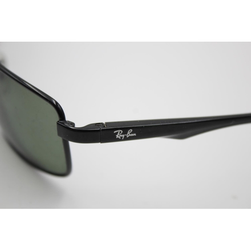 315 - A pair of Ray-Ban black framed rectangular sunglasses with polarized lenses and case