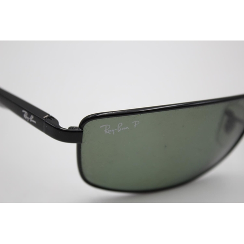 315 - A pair of Ray-Ban black framed rectangular sunglasses with polarized lenses and case