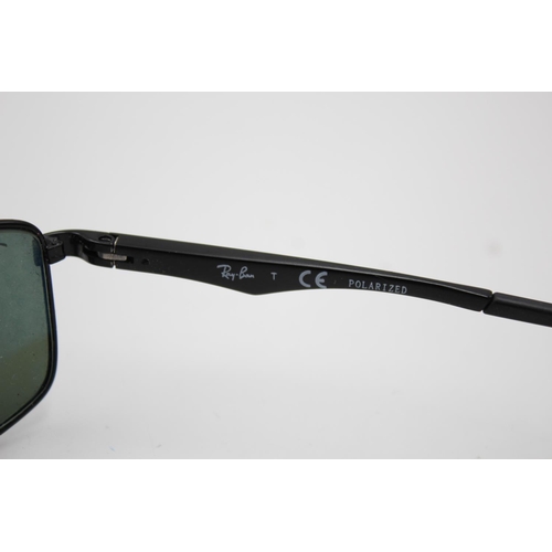 315 - A pair of Ray-Ban black framed rectangular sunglasses with polarized lenses and case