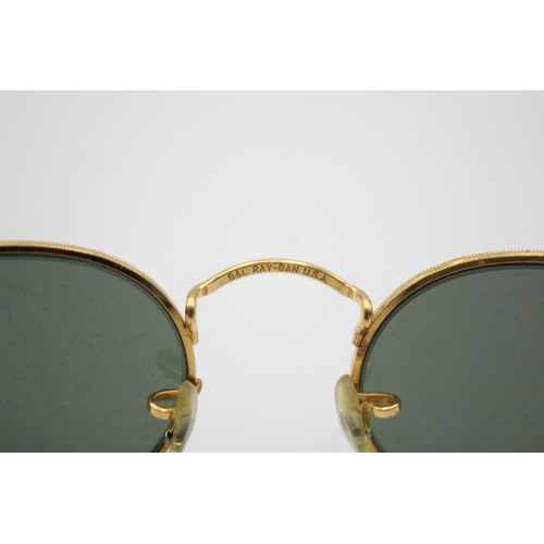 321 - A pair of vintage Bausch & Lomb Ray-Ban gold tone oval sunglasses with case