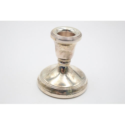 379 - Two hallmarked London silver filled squat candlesticks, dated 2001 - approx. 8.5cm high