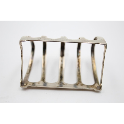 395 - A vintage Viners Ltd. hallmarked Sheffield silver five bar toast rack, dated 1934 - approx. gross we... 