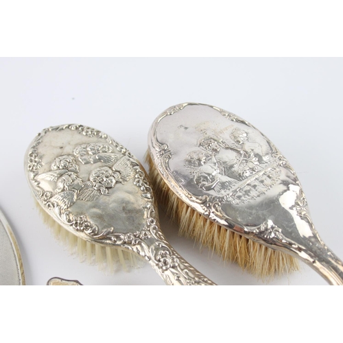 398 - Eight antique hallmarked .925 sterling silver ladies vanity items to include brushes, mirror, handle... 