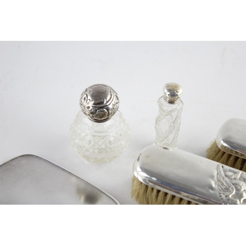 399 - Eight antique hallmarked .925 sterling silver ladies vanity items to include topped scent bottles, b... 