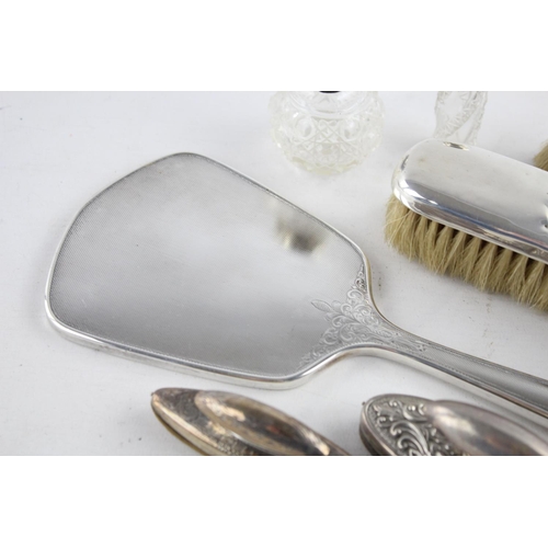 399 - Eight antique hallmarked .925 sterling silver ladies vanity items to include topped scent bottles, b... 