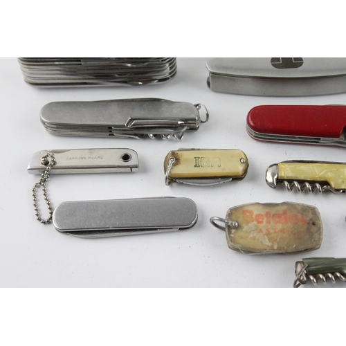 404 - Sixteen assorted pocket knives/tools to include Swiss army, multi-tool etc.