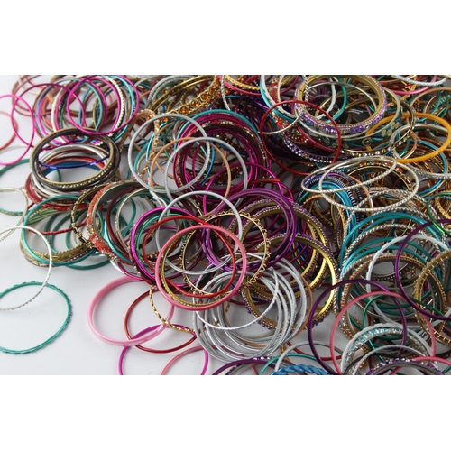 558 - Approximately 2kg of vintage Eastern Tradition stacker bangles