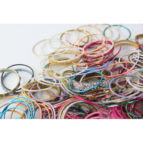 563 - Approx. 2kg of vintage Eastern Tradition stacker bangles