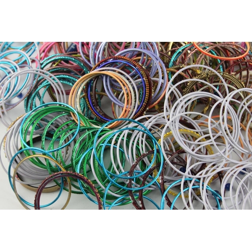 563 - Approx. 2kg of vintage Eastern Tradition stacker bangles