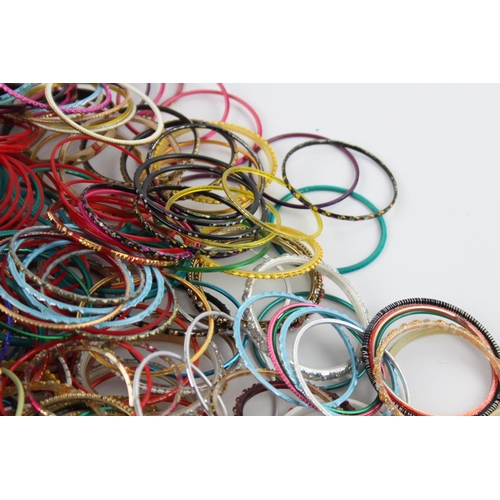 564 - Approx. 2kg of vintage Eastern Tradition stacker bangles