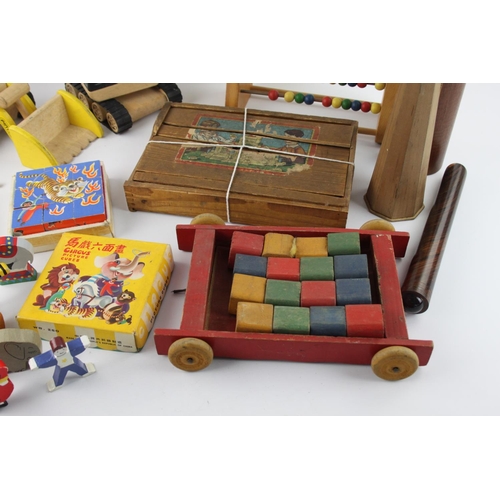 611 - A collection of assorted wooden toys and games to include kaleidoscope, abacus, puzzle etc.