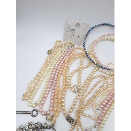 184 - A collection of assorted costume jewellery to include faux pearl necklaces, yellow metal simulated s... 