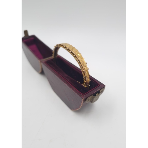 212 - A cased Edwardian hallmarked Birmingham 9ct gold bangle, dated 1901 - approx. gross weight 7.8 grams