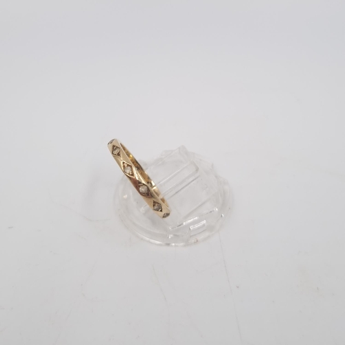 214 - A 9ct gold clear gemstone eternity ring, size O - approx. gross weight 2.2 grams