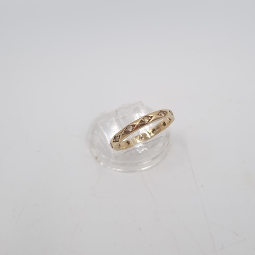 214 - A 9ct gold clear gemstone eternity ring, size O - approx. gross weight 2.2 grams