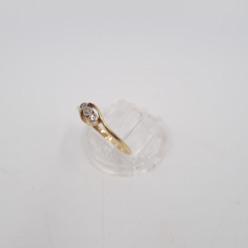 215 - An 18ct gold twist setting diamond trilogy ring, size P½ - approx. gross weight 2.1 grams