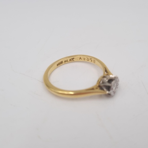 216 - An 18ct gold and platinum diamond solitaire ring, size L½ - approx. gross weight 2.58 grams