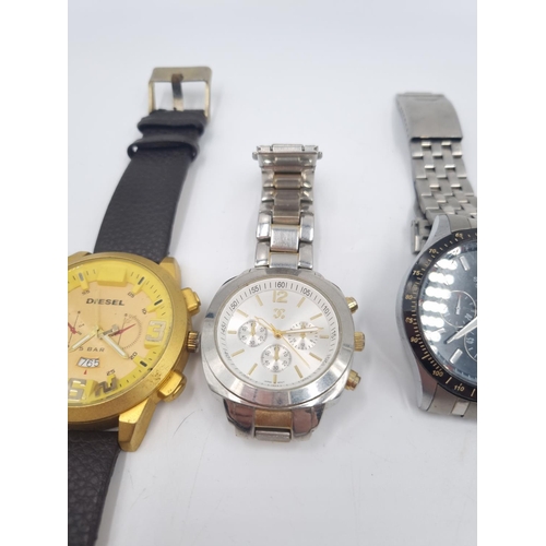 247 - Four assorted men's wristwatches, one Henley, one Charming Charlie, one Sekonda and one Diesel