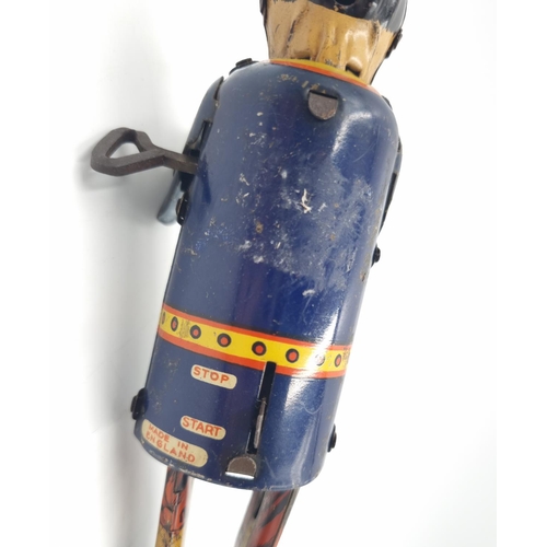 296 - An early/mid 20th century Marx tin plate clockwork climbing fireman toy - approx. 19cm high