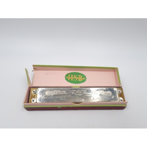 301 - A collection of assorted items to include boxed M. Hohner Song Band Model 1 harmonica, cased pair of... 