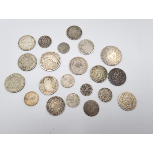 303 - A collection of world coins to include 92.5% silver 1816 shilling, 75% silver 1940 Irish florin, 80%... 